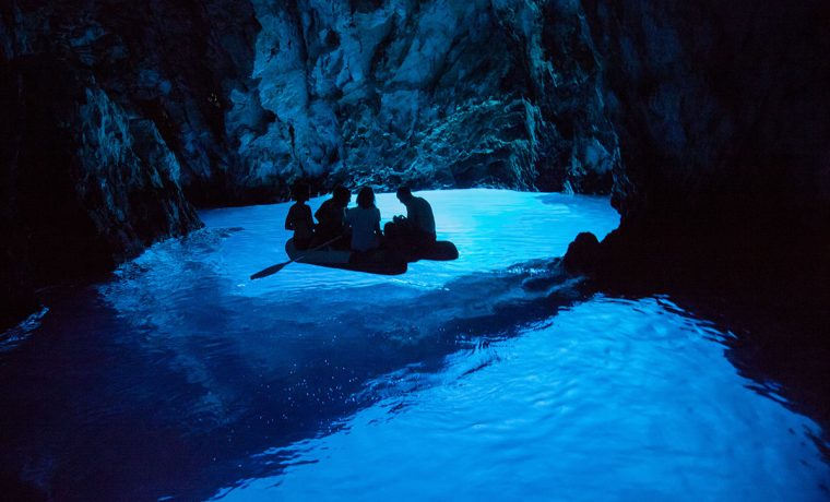 Exploring Blue cave with dinghy