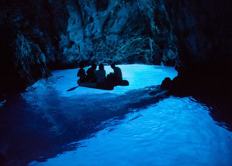 Exploring Blue cave with dinghy