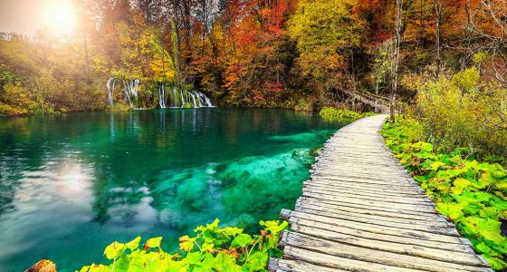 trail by the calm Plitvice lake in spring