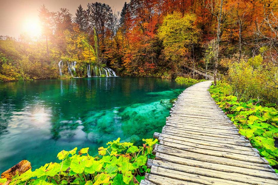 trail by the calm Plitvice lake in spring