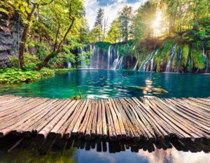 Trail over the calm lake of Plitvice