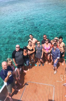 group-photo-on-speedboat-blue cave tour