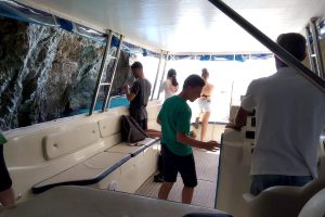 boat entering Monk Seal cave