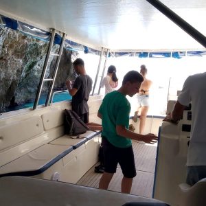 boat entering Monk Seal cave